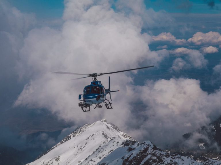 Helicopter flying over mountains