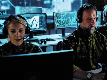male and female operators in defence control room